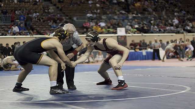 Sportsmanship Madill's Luke Chapman (left) and Tuttle's Austin Elam (right) shake hands before their 160 lbs. Class 4A consolation match.