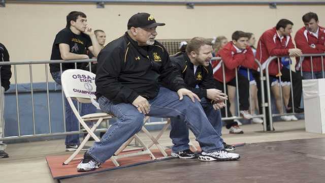 On the edge The coaches were literally on the edges of their seats throughout the state tournament as they watched their athletes compete on the mats.