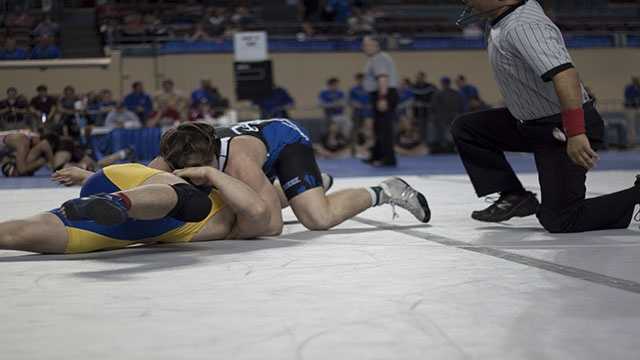 Loomis pins Gerrier Austin Loomis pins Johnathan Gerrier in the Class 5A 220 lbs. consolation finals.
