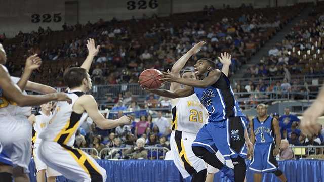 To the hoop Eric Harris (13) makes a lay-up attempt during Coyle's loss to Arnett Saturday night.
