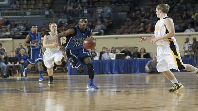 Fastbreak Eric Harris (13) sprints downcourt as he eyes the basket during the boys Class B state championship game.