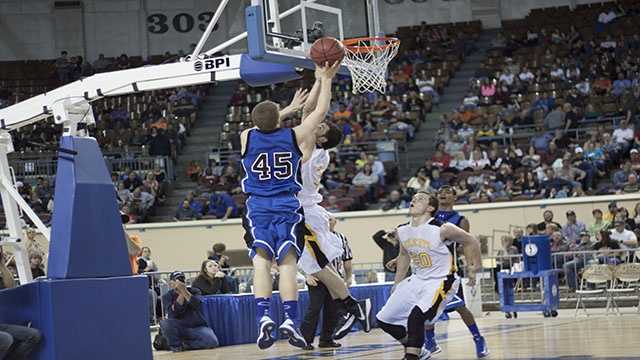 Taking chances Heath Moorman (45) makes an attempt to score with an Arnett player making the attempt to block.