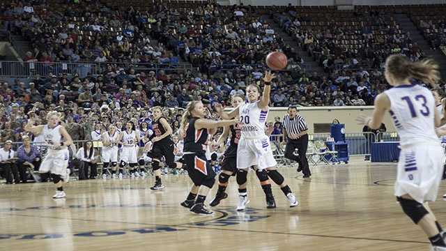 Downcourt Morgan Vogt (20) passes downcourt to a teammate as she gets swarmed by a couple of Cheyenne-Reydon players.