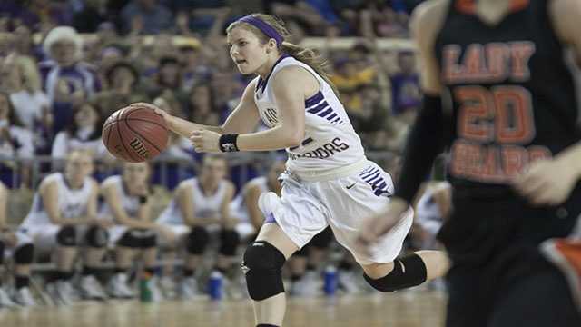 Charge Kenady Grellner (22) charges downcourt during Okarche's 59-47 win on Saturday.