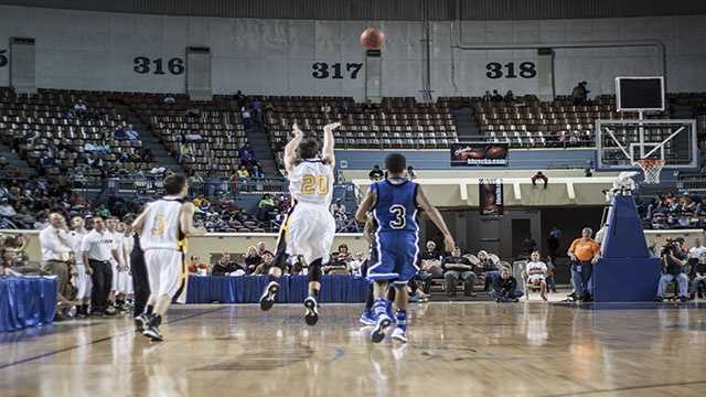 Half-court hurl Arnett's Tyler Tune (20) takes a shot to send the third period during his teams comeback win over Coyle during the boys Class B state championship game, where the Wildcats won 71-60.