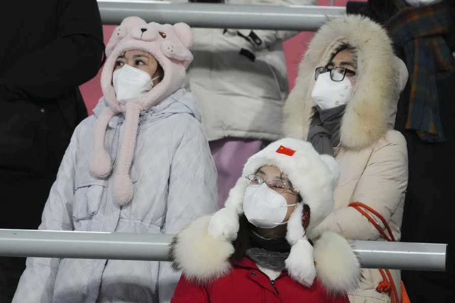 Beijing Olympics Spectators watch during the women's normal hill individual ski jumping final at the 2022 Winter Olympics, Saturday, Feb. 5, 2022, in Zhangjiakou, China. (AP Photo/Matthias Schrader)