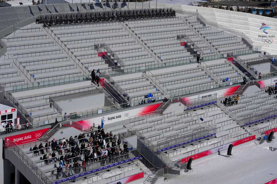 Beijing Olympics Getting A Glimpse Photo Gallery People watch the during the men's normal hill individual ski jumping trial round in a nearly empty Zhangjiakou National Ski Jumping Centre.