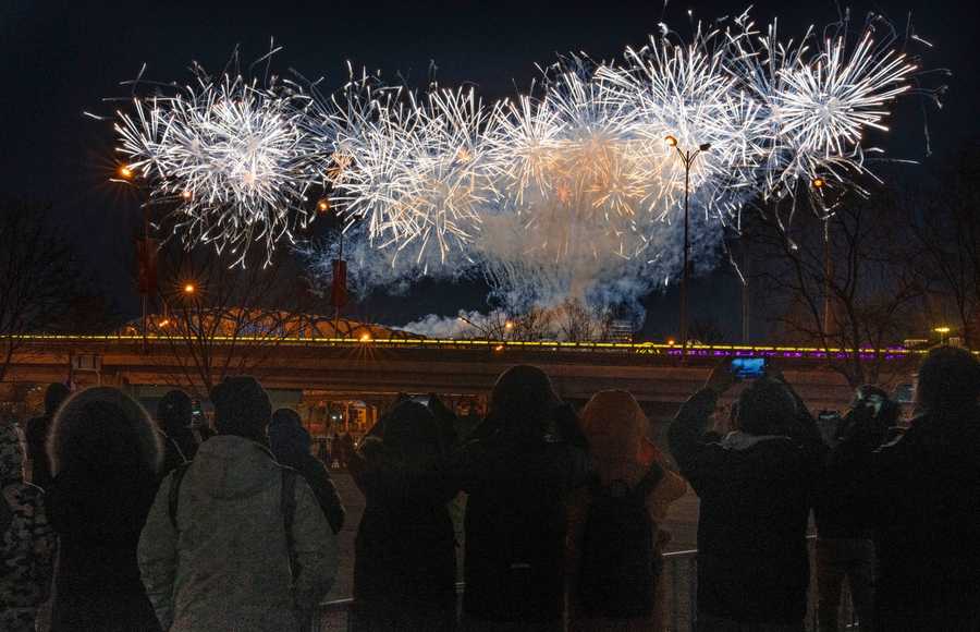Beijing Olympics Getting A Glimpse Photo Gallery A crowd watches as fireworks explode at the opening ceremony.