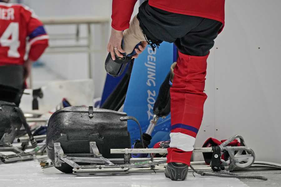 Paralympic Games Czech Republic's Jiri Raul prepares to get into his sledge during his para ice hockey preliminary round match against Italy at the 2022 Winter Paralympics, Saturday, March 5, 2022, in Beijing.